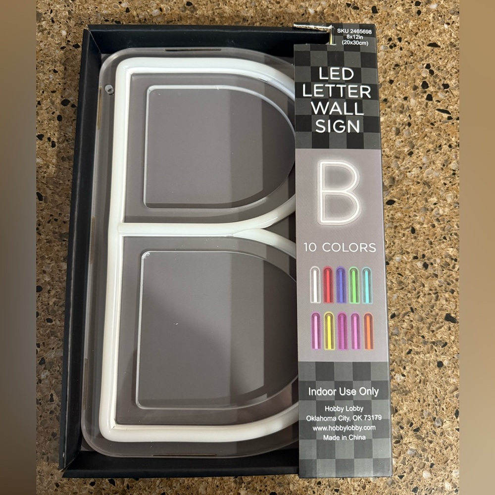 Neon letter wall sign